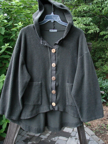 Barclay Celtic Moss Swing Hooded Jacket Unpainted Army Grey Size 2 displayed on a mannequin. Features oversized buttons, cozy hood, A-line shape, and drop pockets, offering a plush, textured feel.