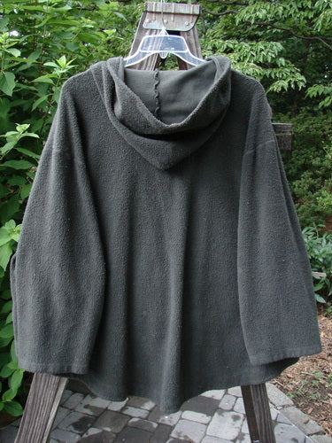 Barclay Celtic Moss Swing Hooded Jacket Unpainted Army Grey Size 2 displayed on a swing, showcasing its plush, dense texture, cozy hood, and oversized buttons, capturing the unique vintage style of BlueFishFinder.com.