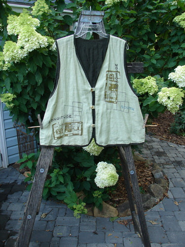2000 Cross Dye Linen Edge of the World Vest Directional Grid Celery Size 0 displayed on a wooden ladder, featuring rolled piping, looped button closures, and handmade glazed ceramic buttons.