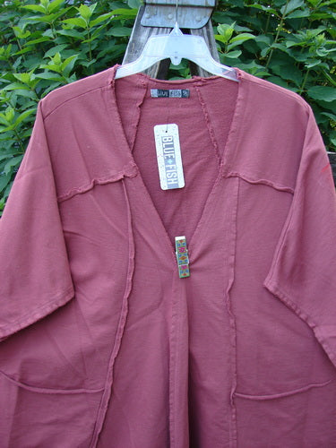 Barclay NWT Photogram Open Front Jacket in Walt Whitman Script, Desert Rose, features a raw-edged, angular hem and generous three-quarter sleeves, showcasing vintage style from BlueFishFinder.com.