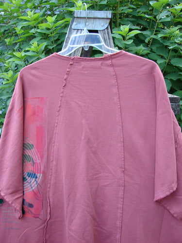 Barclay NWT Photogram Open Front Jacket in Walt Whitman Script Desert Rose displayed on a swinger, showcasing its wide three-quarter sleeves, angular hem, and dolman shoulders in a flowing, boxy silhouette.