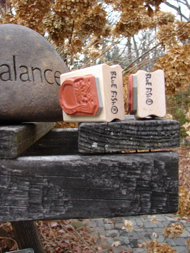 Close-up of two 1997 New Rubber Stamps featuring a high heel pump and a fancy handbag, both mounted on wooden blocks, highlighting their mint condition and intricate designs.
