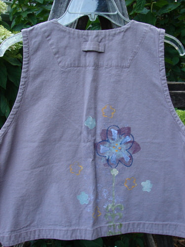 2000 Parachute Cross Stitch Vest Floral Pale Purple Altered Size 0 features a deep V-neck, metal button closures, and a bright floral pattern, showcasing a breathable, textured fabric with side alterations.