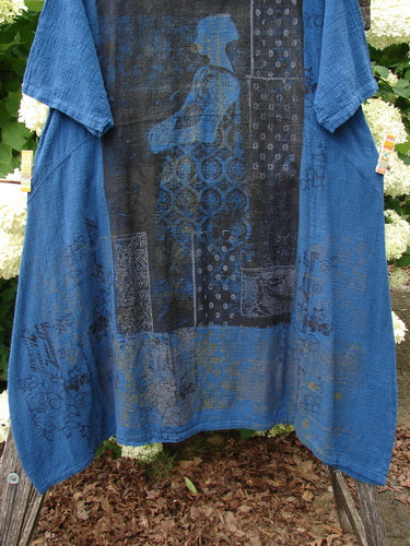 Barclay NWT Textured Gauze Chaya Tunic Window Meditation in indigo, Size 1, with a loose blue gauze drape and a large black graphic panel across the front. The textured fabric hangs in soft folds, showing wide sleeves and a layered, artisanal print.