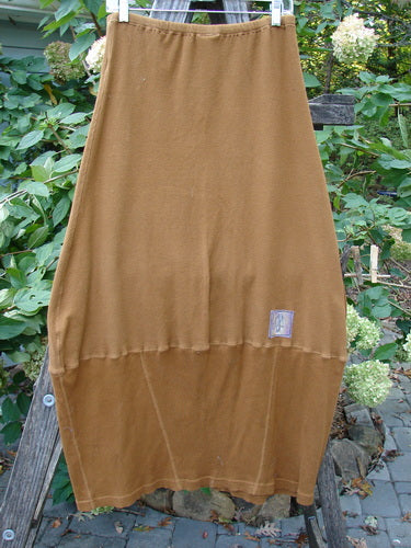 Barclay Patched Thermal Parlor Skirt Floral Copper Size 0 displayed outdoors, showcasing its generous cut and unique vertical and horizontal stitchery, highlighting the vintage aesthetic of Blue Fish Clothing.