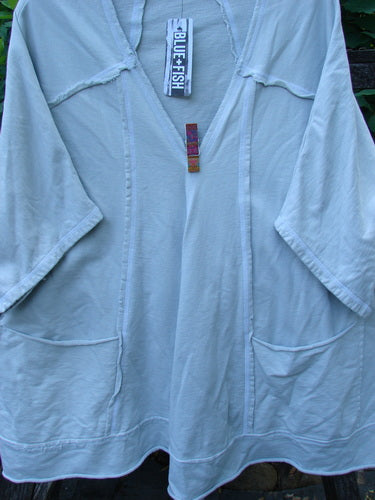 Barclay NWT Photogram Open Front Jacket Unpainted Dew OSFA on a hanger, showcasing its wide three-quarter sleeves, open front, angular hem, and raw edges, embodying vintage Blue Fish Clothing style.