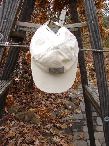1999 Patched Men's Baseball Cap with Wheat Sprig BF Logo in Natural. Fully adjustable with cloth covered button, star stitchery, and grommet air holes.