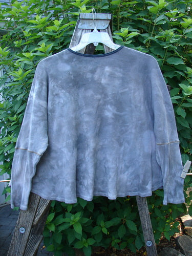 Barclay Thermal Crop Top Belief Spirit Mottled Plum River OSFA on a hanger, showcasing its waffle texture, rounded neckline, crop length, drop shoulders, fitted sleeves, and unique vintage-inspired stitchery.