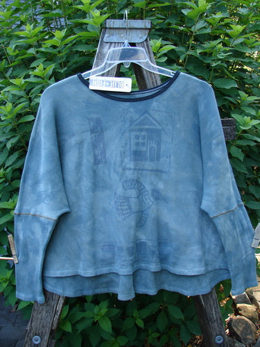 Barclay NWT Thermal Crop Top Love Dove Mottled Top Lake OSFA featuring a scooped neckline, A-line flair, crop length, drop shoulders, and narrowing sleeves, captured hanging outdoors on a swinger.