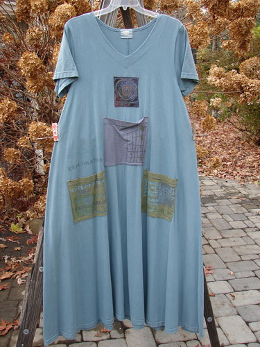 2000 PMU City Side Dress with patches, painted pockets, V neckline, and Blue Fish patch. Organic cotton, A-line shape. Size 1. 56" length.