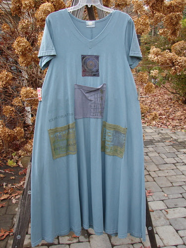 2000 PMU City Side Dress Directional Puddle Size 1 featuring organic cotton with painted pockets, a V-shaped neckline, and unique patches, showcasing Bluefishfinder’s vintage, artistic style.