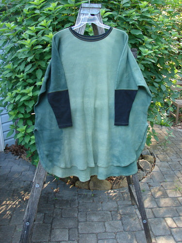 Barclay Thermal Contrast Revival Top Unpainted Mottled Field Moss OSFA displayed on a rack, showcasing its ribbed sleeves, rounded neckline, and A-line shape, reflecting vintage Blue Fish Clothing style.