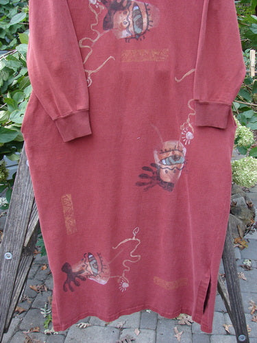 1996 Pastime Dress Abstraction Ember Size 2, featuring a painted face design, long sleeves with ribbed cuffs, and a crossover ribbed neckline, highlighting Blue Fish's creative, vintage style.