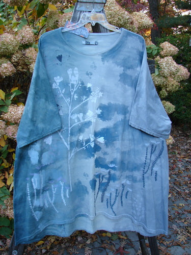 Barclay NWT Art Top Botanical Tree Emerald Fog OSFA, featuring a blue tunic with white floral patterns, drop shoulders, three-quarter sleeves, and a rounded neckline.