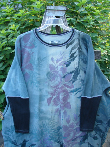 Barclay Thermal Contrast Revival Top Rose Garden Dusky Dusk OSFA featuring ribbed sleeves, a rounded neckline, and a unique farm theme design, highlighting its distinctive A-line shape and side vents.