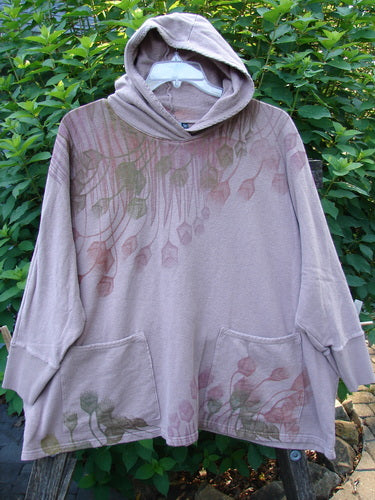 Person wearing Barclay Cotton Hemp Hooded Folklore Pullover Tiny Floral Mallow OSFA, featuring a cordless hood, ribbed cuffs, long sleeves, flared swing, and dual painted pockets, embodying BlueFishFinder's vintage charm.