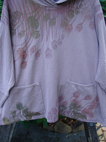 Barclay Cotton Hemp Hooded Folklore Pullover Tiny Floral Mallow OSFA, showcasing a cozy cordless hood, ribbed cuffs, dual drop pockets, and a wide square flared swing with a tiny floral design.