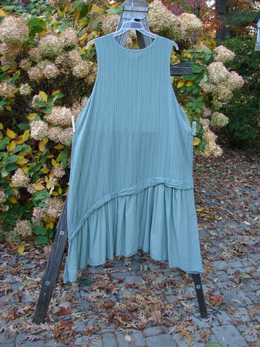 Barclay NWT Gauze Varano Jumper Olive Navy Pinstripe Size 2 displayed on a rack, showcasing its lightweight organic cotton gauze material with subtle under stripe tone and a ruffled hem.