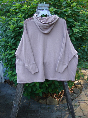 Barclay Cotton Hemp Hooded Folklore Pullover Tiny Floral Mallow OSFA displayed on a rack, showcasing its cordless hood, ribbed cuffs, wide flared swing, and dual drop pockets with a floral theme.