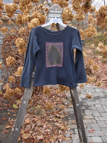 1997 PMU Patched Thermal Long Sleeved Top with Leaf Patch, Size 1: Cozy black cotton thermal top with ribbed neckline and tapered shape.