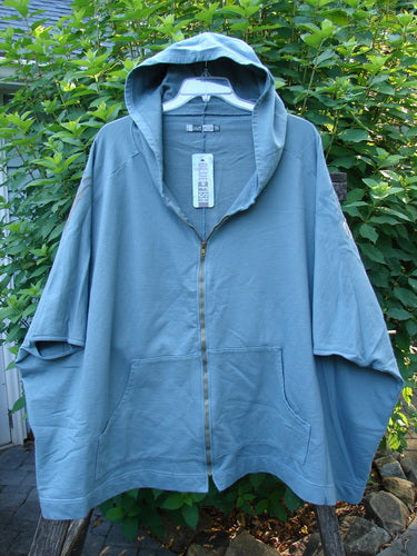 Barclay NWT Hooded Postcard Zipper Jacket Vest Rear Tree Love Delaware Green OSFA displayed on a hanger, showcasing its generous hood, full zipper, roomy pockets, and unique dolman shoulders with a sweeping hemline.