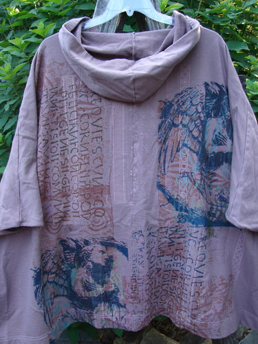 Barclay Hooded Postcard Zipper Jacket Vest in Vintage Rose, showcased on a swing. The design features a sweeping hemline, roomy pockets, and distinctive rear Roman wings motif. Perfect for expressing individuality.