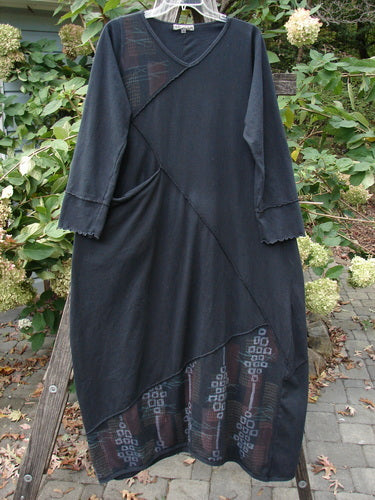 Barclay Diagonal Pocket Dress Stick Stone Black Size 0 hanging on a rack, showcasing its patchwork design, wide A-line shape, and distinctive diagonal seams, embodying BlueFishFinder's vintage aesthetic.