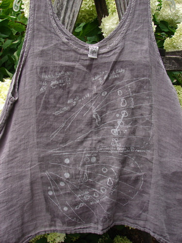 Barclay Linen Altoll Top Wing Stats in rose quartz, size 0, is a sleeveless linen top with a soft crinkled texture, wide shoulder straps, and a faded white wing graphic across the front. It hangs loosely in muted mauve-gray light.