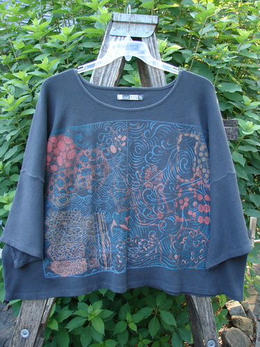 Barclay Thermal Boxy Crop Top Windy Garden Raven OSFA showcased on a swinger, highlighting its roomy three-quarter sleeves, crop length, and scooped neckline with a unique windy garden theme paint.