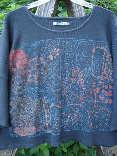 Barclay Thermal Boxy Crop Top Windy Garden Raven OSFA features a unique windy garden graphic on a soft, waffle-textured fabric, with a rounded neckline, cropped length, and three-quarter drop sleeves.