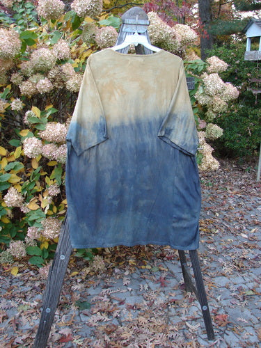 Barclay NWT Art Top Sunfield Bronze Gold OSFA displayed on a swinger, featuring a loose fit with three-quarter sleeves, a rounded neckline, and an upward rounded front hem.