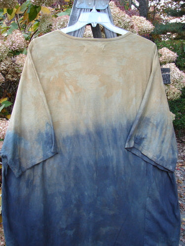 Barclay NWT Art Top Sunfield Bronze Gold OSFA displayed on a hanger, featuring a longer tunic length, drop shoulders, loose three-quarter sleeves, and a rounded neckline with a varying hemline.