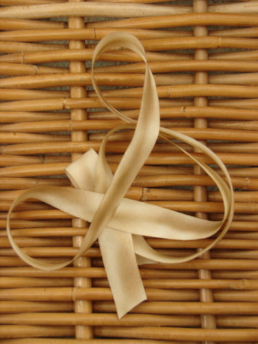 Blue Fish Hand Dyed Silk Ribbon in Fawn Dusk 108 x 5/8th, close-up view, showcasing delicate texture and precise bias cut from the original spool. Ideal for vintage Blue Fish clothing adornments.