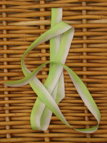 Blue Fish Hand Dyed Silk Ribbon in Italian Wall, woven on a textured surface, measuring 108 inches long by 5/8 inches wide, showcasing its light, flowing, and unique hand-dyed color variance.