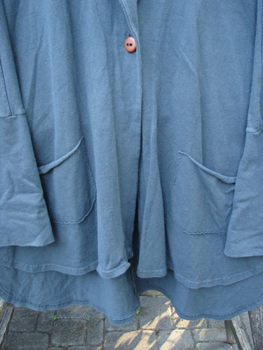 Barclay Reprocessed Golden Hour Deco Jacket Rear Rain Black Olive OSFA features dense cotton, drop dolman shoulders, and a deep V-shaped neckline with oversized diagonal pockets, embodying BlueFishFinder's vintage style.