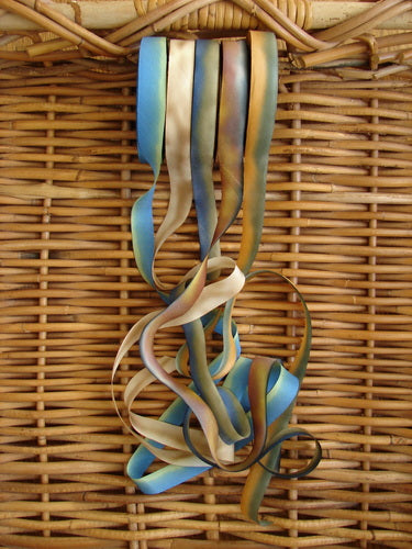 Blue Fish Hand Dyed Silk Ribbon in Fawn Dusk 108 x 5/8th, shown in a close-up view, highlighting its fine, flowing texture and unique hand-dyed color variances.