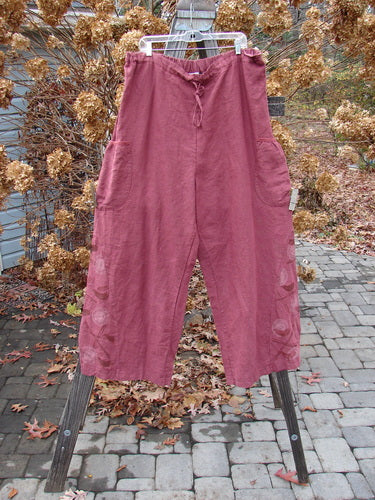 Barclay Linen Heavy Tie Travel Pant Tiny Birdie Merlo Size 2 on a rack, featuring a billowy shape, triangular side inserts, and a drawcord waistline with elastic back.