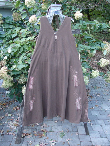 1997 Charmer's Jumper Magic Forest Mandorla Size 1 displayed on a wooden rack, showcasing its sleeveless jumper style, A-line flair, and unique keyhole front with shell button detailing.