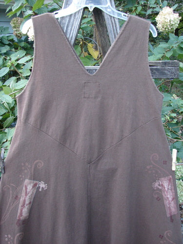 1997 Charmer's Jumper Magic Forest Mandorla Size 1 displayed on a wooden rack, featuring a sleeveless jumper style with a wide A-line flair and a sweet keyhole front.