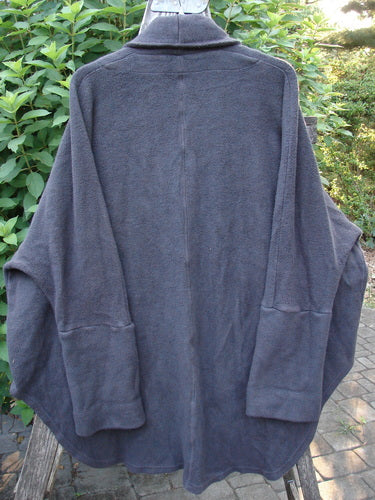 Barclay Patched Celtic Moss Deco Coat Unpainted Stormy Black OSFA, showcasing oversized vintage button, deep V neckline, drop dolman shoulders, and huge foldable sleeves, highlighting its cozy, textured fabric.