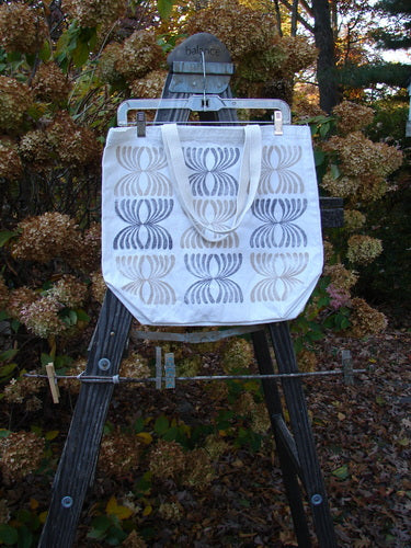 Barclay Promo Tote Bag Shop Locations Owl Natural OSFA displayed on a wooden ladder outdoors, featuring a unique village logo and owl art, with a short shoulder strap and deep rounded bottom.