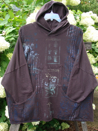 Barclay Cotton Lycra Dolman Roo Pocket Hoodie in Pansy Rose Deep Bark, OSFA, shown as a loose dark plum hooded pullover with wide dolman sleeves, a front roo pocket, and faded blue graphic accents on soft cotton-lycra fabric.