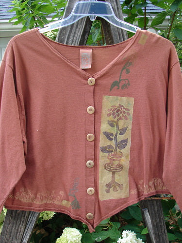 1994 Curve Shirt Potted Sunflower Ochre Size 1, featuring a V-shaped neckline, original Blue Fish buttons, and a potted sunflower design on a varying hemline.