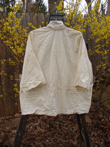 Magnolia Pearl NWT Cotton Poplin Wabi Kimono Natural OSFA displayed on a hanger, showcasing its open front and square boxy shape, ideal for layering with other Pearl pieces.