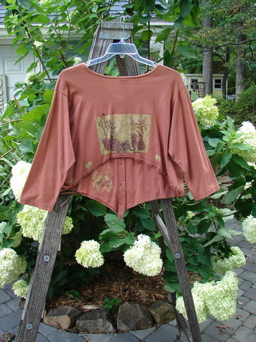 1994 Curve Shirt Potted Sunflower Ochre Size 1 displayed on a wooden rack, showcasing its varying hemline, V-shaped neckline, and original Blue Fish buttons.