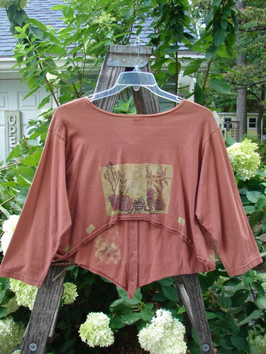 1994 Curve Shirt Potted Sunflower Ochre Size 1 displayed on a hanger with a distinct hemline, V-neck, and original buttons, showcasing the classic potted sunflower theme from BlueFishFinder's vintage collection.