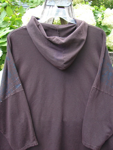 Barclay Cotton Lycra Dolman Roo Pocket Hoodie in Pansy Rose Deep Bark, an OSFA pullover with a draped hood, relaxed dolman sleeves, and a roomy chest pocket. The soft cotton-lycra knit appears in a deep bark brown with muted rose undertones.