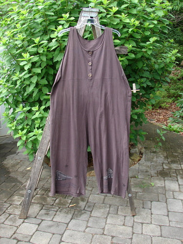 Close-up of the 1993 Wide Pant Overall Jumper Star Path Travel Redyed Dark Plum Size 1, showcasing super wide belled legs and three unique front buttons, embodying BlueFishFinder's vintage style.