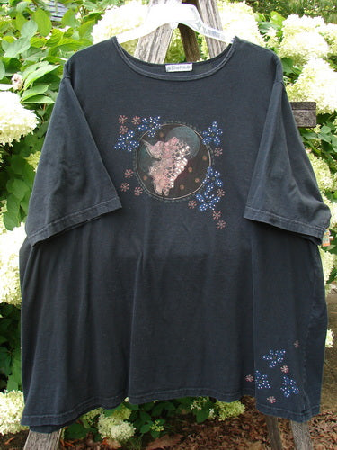 Barclay Short Sleeved Studio Tee Magic Moon Cloud in black, size 3, shown as a loose short-sleeve T-shirt with a round neck and faded cotton texture. A moon-and-cloud graphic sits on the chest, with scattered floral-like dots near the hem.