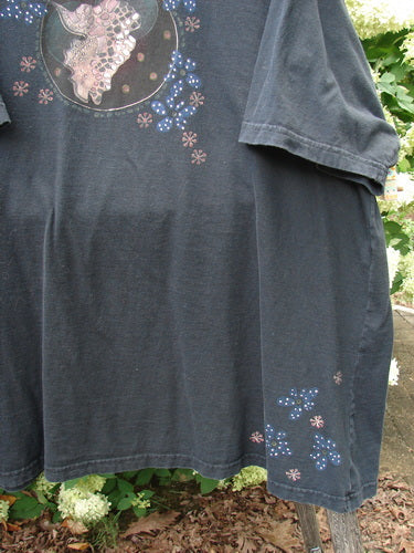 Barclay Short Sleeved Studio Tee Magic Moon Cloud in black, size 3, with a relaxed short-sleeve cut and faded dark cotton knit. The front shows a moon-and-cloud graphic with scattered floral-like dots, while the hem and sleeve carry small starry accents.